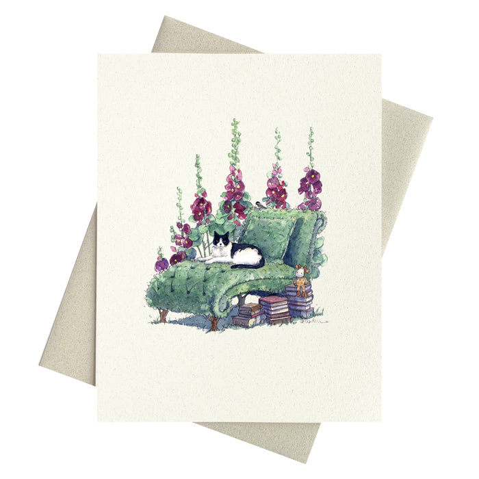 Black and white cat on topiary chaise lounge in garden setting surrounded by hollyhocks and books printed on recycled paper notecards