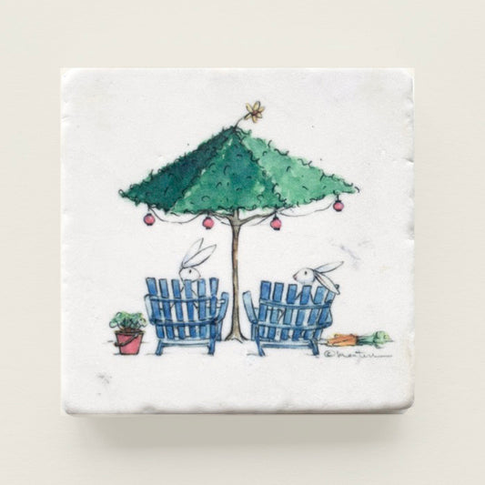 Two bunnies talking under topiary umbrella printed on a marble coaster.