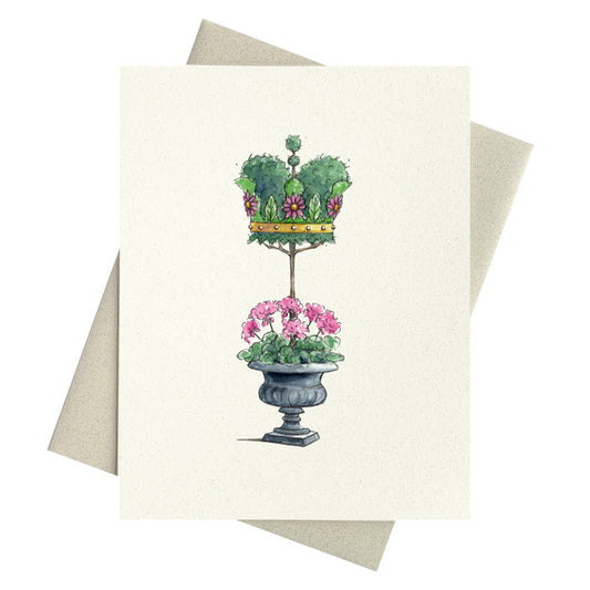 Beautiful Crown shaped topiary growing out of urn full of pink geraniums.