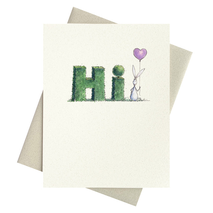 Hedge shaped into letters saying HI with bunny and balloon notecard