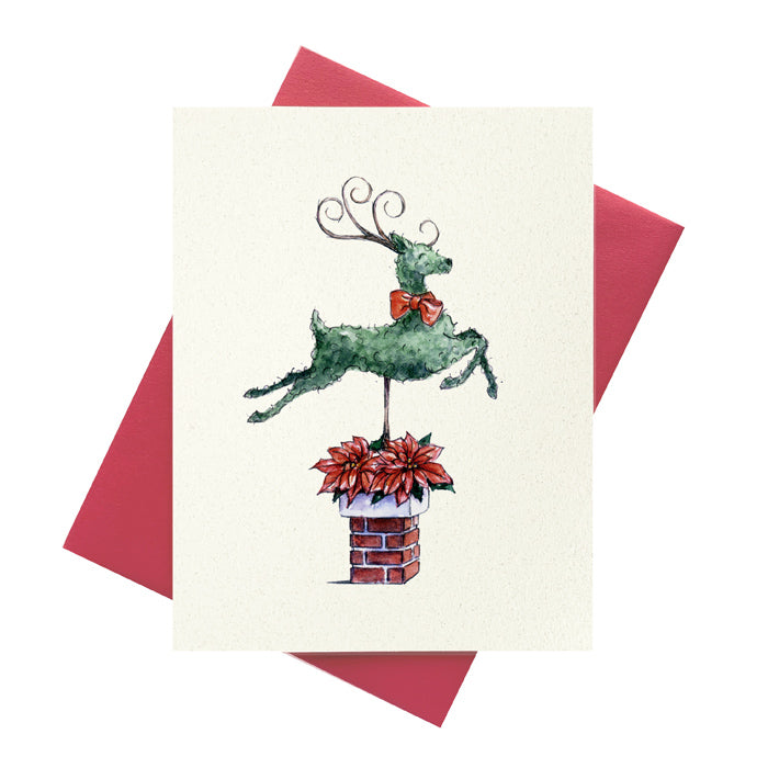 Topiary Reindeer jumping over bricked chimney pot adorned with poinsettias printed on greeting card.