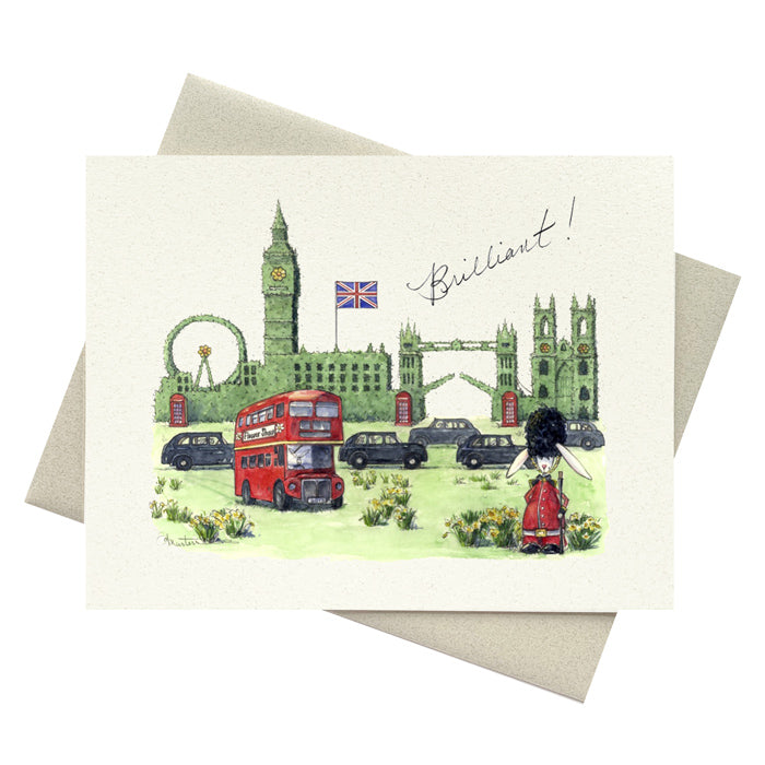 London landmarks in topiary hedge with whimsical taxis, double decker bus and British flag includeing the word Brilliant! in script.