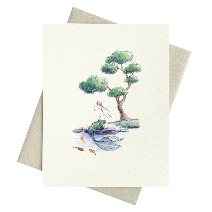 Bunny mermaid sitting below a cloud topiary tree notecard by Michelle Masters Studio.