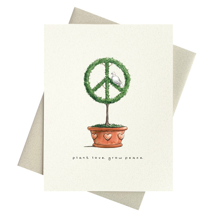 Peace symbol topiary planted in pot with hearts. Plant love. Grow peace. printed below.