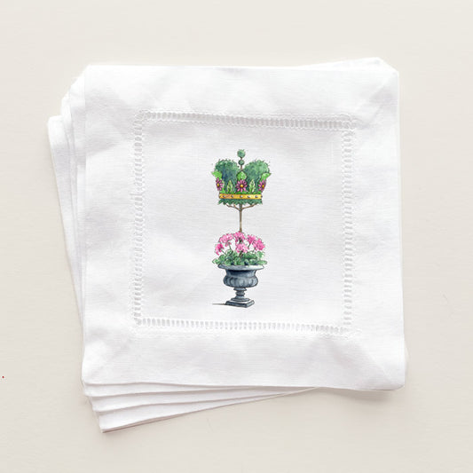 Linen coaster napkins printed with topiary crown design.