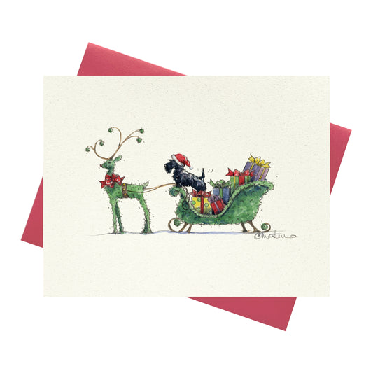 Scottie dog in topiary sleigh with topiary reindeer on holiday greeting card.